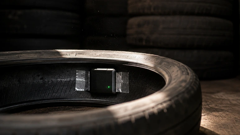 A GPS tracker taped inside a used tyre in a shipping container
