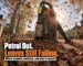 Giant petrol leaf blower standing silent on a British street while autumn leaves pile up around it